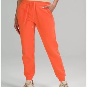 NWT Lululemon scuba HR joggers, size 8. They are a beautiful orange color.